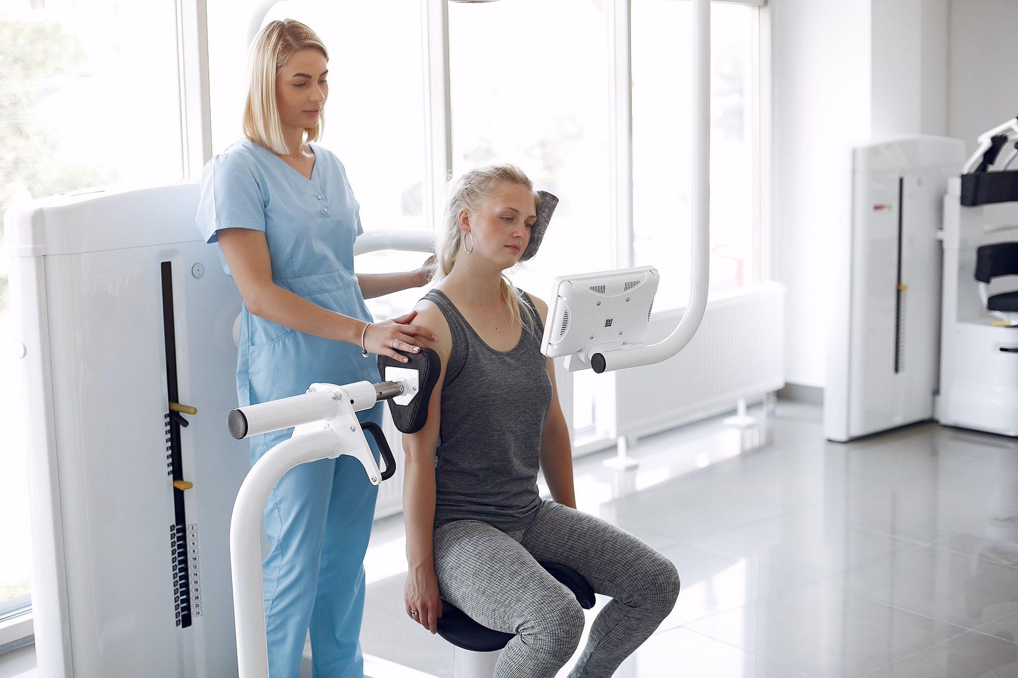 A woman having rehabilitation after injury in a physiotheraphy room